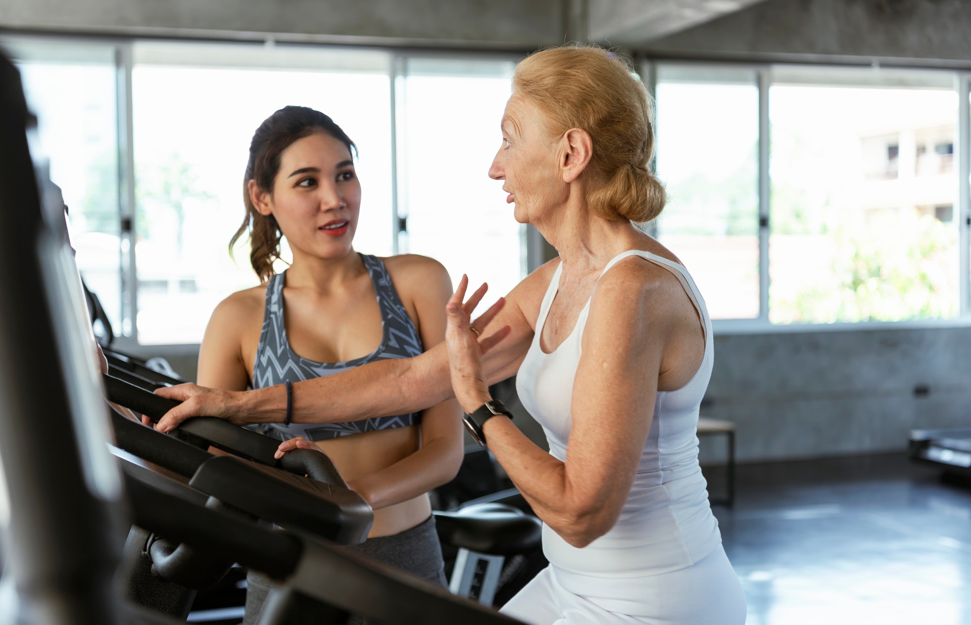 healthcare physio therapy sports trainer with her client in fitness